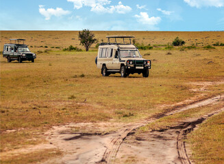 AMBOSELI, Kenya - MAY 2014. Tourist in jeep safari in the road of National Park of Kenya. They are traying see animals.