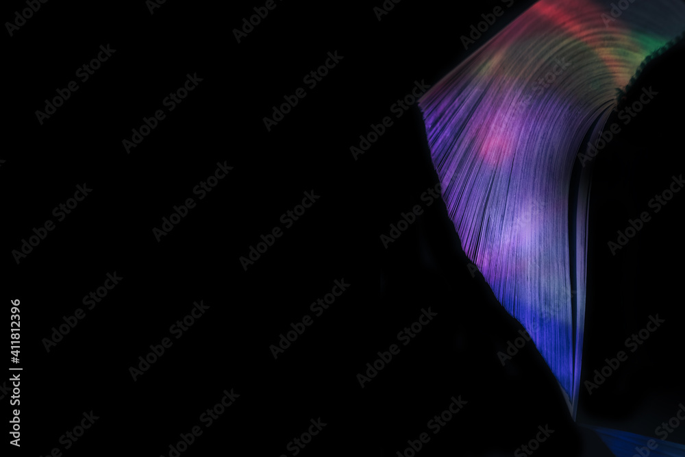 Leinwandbilder close up beautiful book pages in the multi color light on a night. background pattern for design. ma