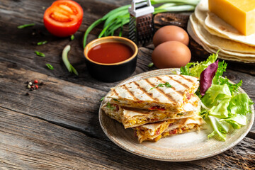 Mexican tortilla quesadilla with scramble eggs, vegetables, ham and cheese, Mexican cuisine, Mexico and Latin America traditional restaurant menu dish, food cooking recipe book cover