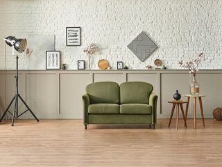 Brown and white brick wall background classic style, green sofa coffee table, frame poster home accessory and black lamp.