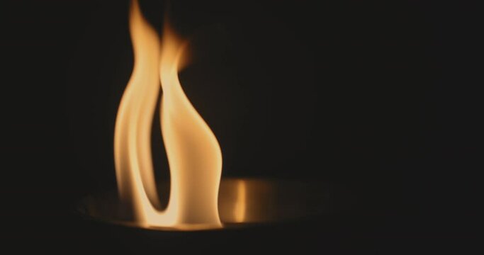 Fire dancing against dark background 120fps slow motion loopable footage