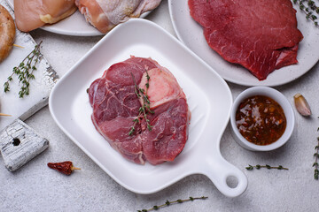 Raw uncooked ossobuco steak with spices