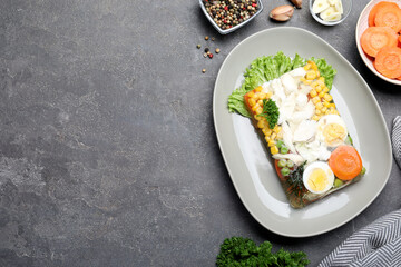 Delicious fish aspic served on grey table, flat lay. Space for text