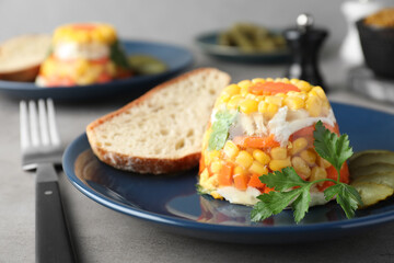 Delicious fish aspic served on grey table, closeup