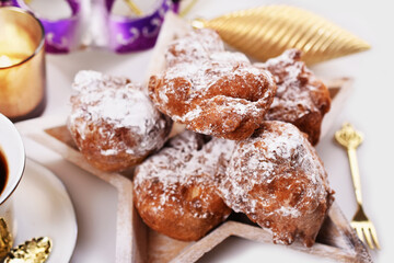 Fototapeta na wymiar homemade doughnuts sprinkled with icing sugar called racuchy for carnival party
