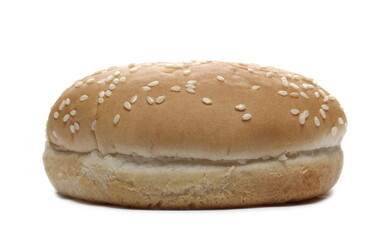 Burger bun with sesame seeds isolated on white background