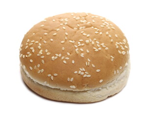 Burger bun with sesame seeds isolated on white background