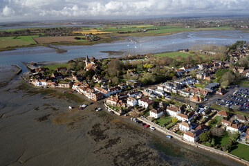 Bosham Village and estuary aerial view with dramatic cumulus cloud on the horizon.