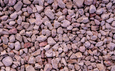 Stone background. blue gravel. Granite texture. The rocky road. Construction material. The texture of the stones. Wallpaper with fine gravel.