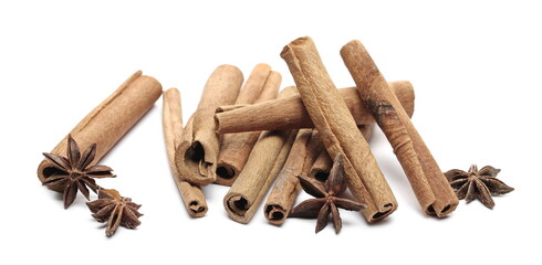 Cinnamon sticks and star anise pile isolated on white background