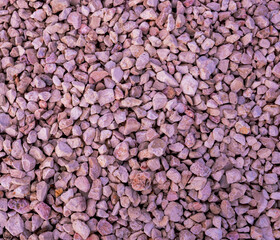 Stone background. blue gravel. Granite texture. The rocky road. Construction material. The texture of the stones. Wallpaper with fine gravel.