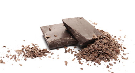 Chocolate pieces and grated flakes, shavings pile isolated on white background