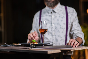 young man in restaurant with wine