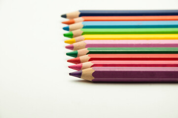 Fototapeta premium colored pencils on a white background. education concept. illustration of training.