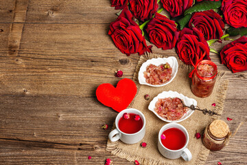 Tea time with rose petals jam and hot beverage