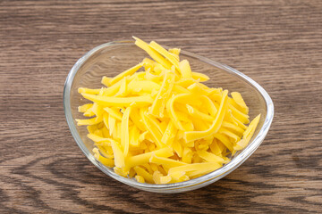 Shredded yellow cheese in the bowl