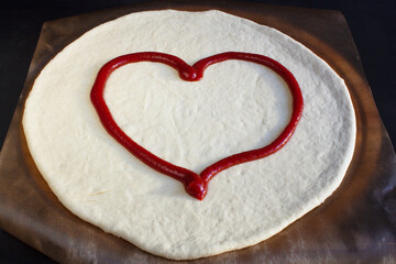 Make a pizza to eat on the day of love. Valentines Day concept
