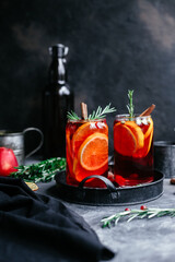 Hot mulled wine in a transparent glass on the table