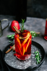 Hot mulled wine in a transparent glass on the table