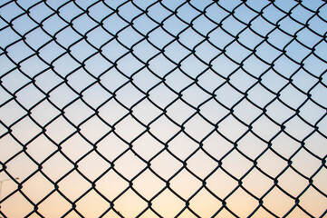 Fototapeta premium Abstract steel mesh background evening sky