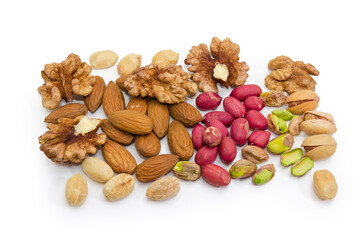 Peeled various nuts scattered on a white background