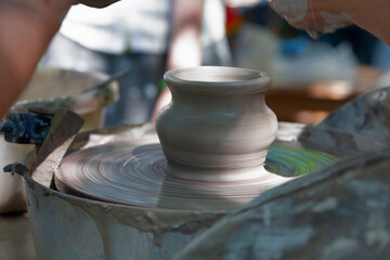 Potter shaping a ceramic pot