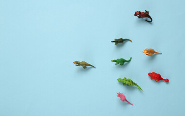 Toy dinosaurs on a blue background
