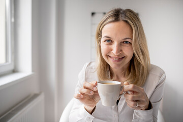 Business woman enjoy coffee break while working in 5office
