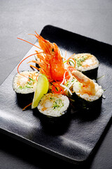 creative sushi set on the dark background