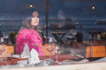 Beautiful young girl resting on the sea