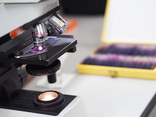 Selective focus microscope and blurry microscope glass slide in a box for scientist diagnosis...