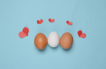Eggs with hearts on a blue background. Spring, easter concept