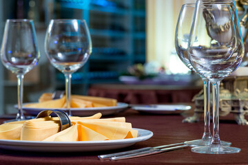 beautifully laid tables with glasses   at morning in restaurant