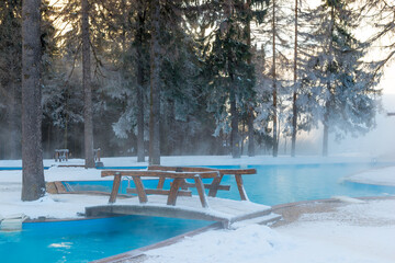 Open-air swimming pool with warm water in winter