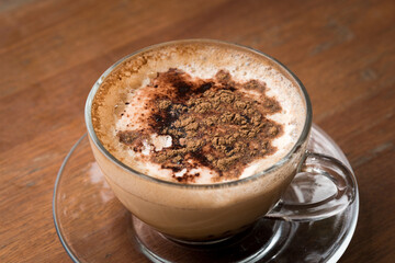 Glass Cup of Cappuccino Coffee on Wooden Table