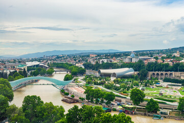Beautiful view of Kura river and Bridge of Peace in Tbilisi, Georgia