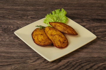 Baked potato with herbs and spices