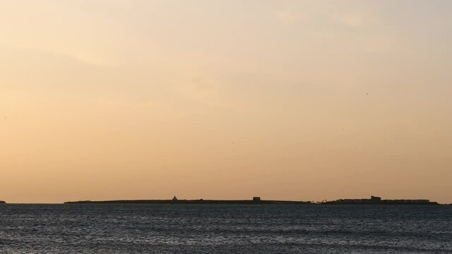 Seascape at morning. Tabarca island on horizon, Santa Pola, Alicante province, Valencian community, Spain.