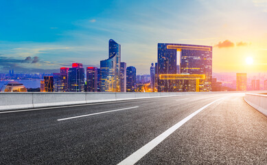 Plakat Asphalt road and modern city skyline with buildings in Hangzhou at sunset.