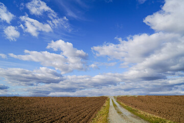 Fototapeta premium Clouds and landscape on a February afternoon in Bavaria