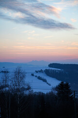 beautiful sunset over mountain range with Tatra Mountains on the horizon