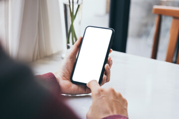 cell phone blank white screen mockup.woman hand holding texting using mobile on desk at office.background empty space for advertise.work people contact marketing business,technology