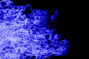 Fototapeta na wymiar Blue flame on black background