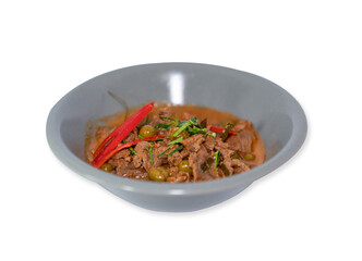 Spicy beef curry with eggplant in grey bowl.