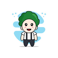 Obraz na płótnie Canvas Cute geek boy character wearing broccoli costume.