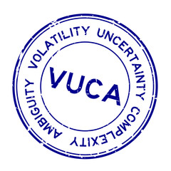 Grunge blue VUCA (abbreviation of Volatility, uncertainty, complexity and ambiguity) word round rubber seal stamp on white background