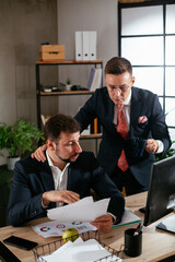 Colleagues in office. Two businessman discussing work in office..