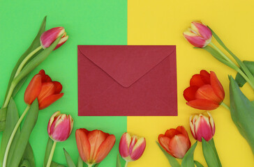 red and pink tulips in the circle, empty red envelope in the middle.