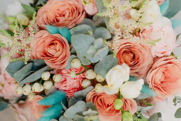 Wedding flowers, bridal bouquet close-up. Decoration of roses, peonies and ornamental plants,...