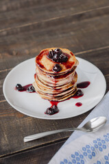Delicious pancakes with cherry jam, soft focus.
